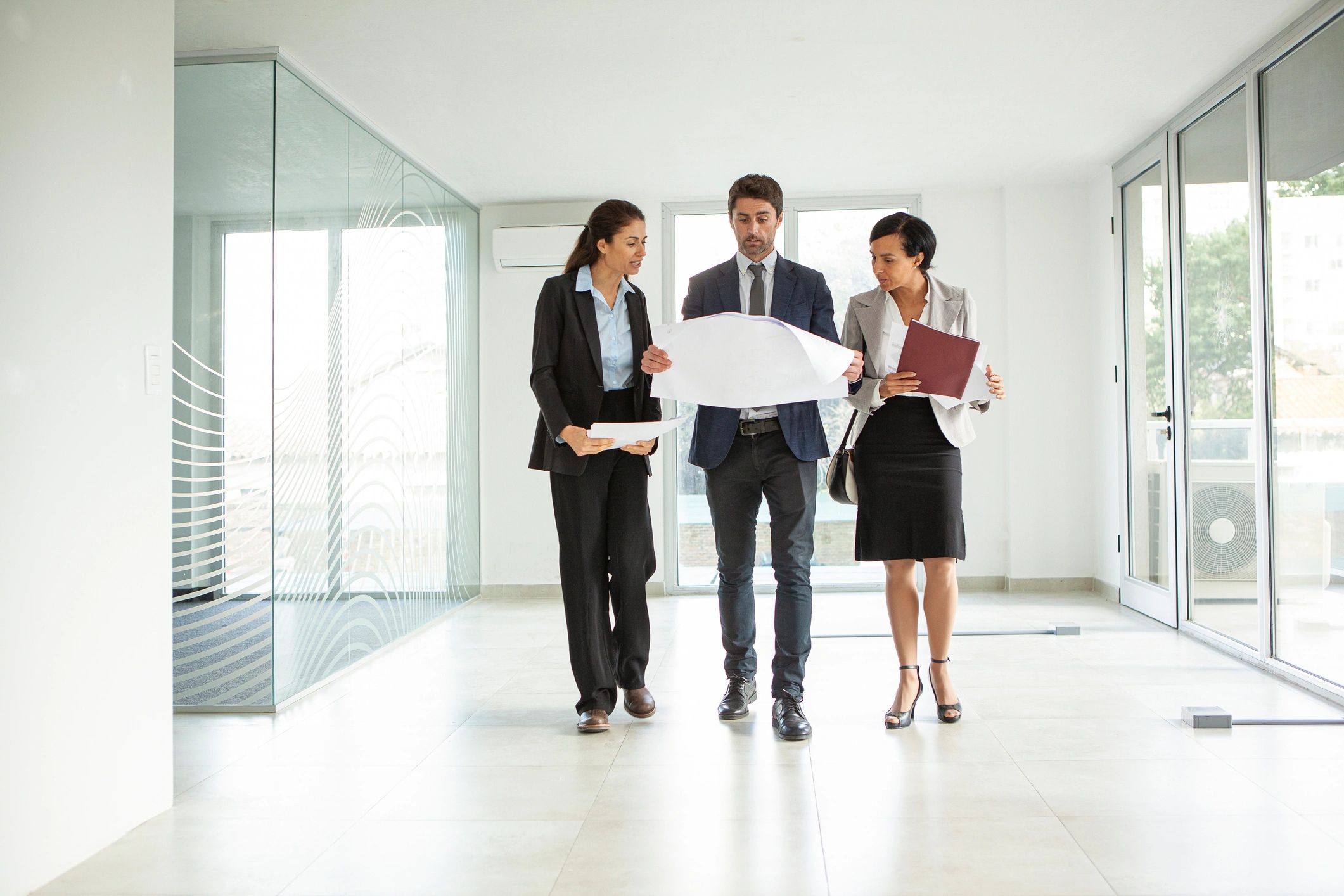 Real estate professionals reviewing plans together