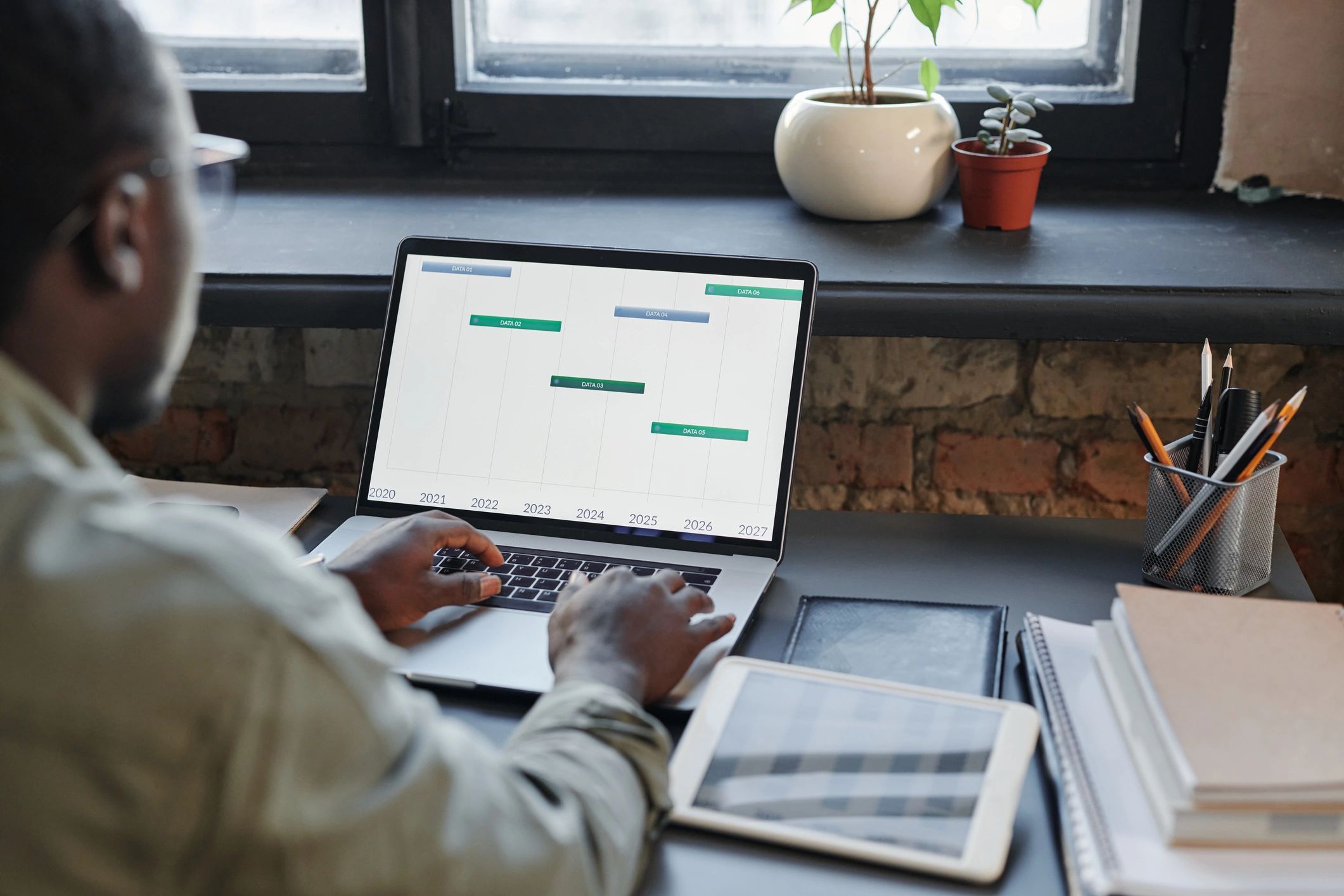 Professional working with property data on a laptop