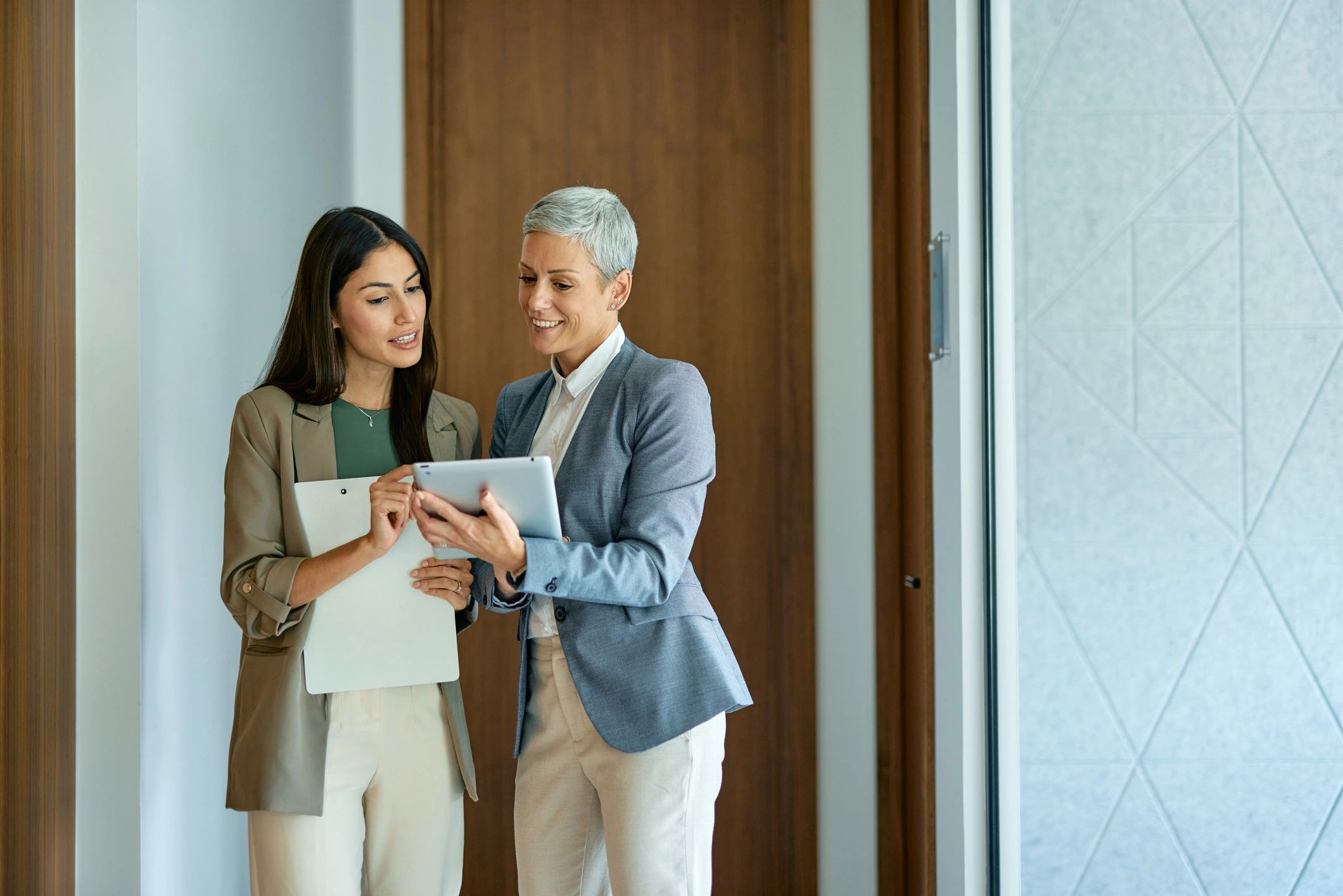 Professionals reviewing property information on a tablet