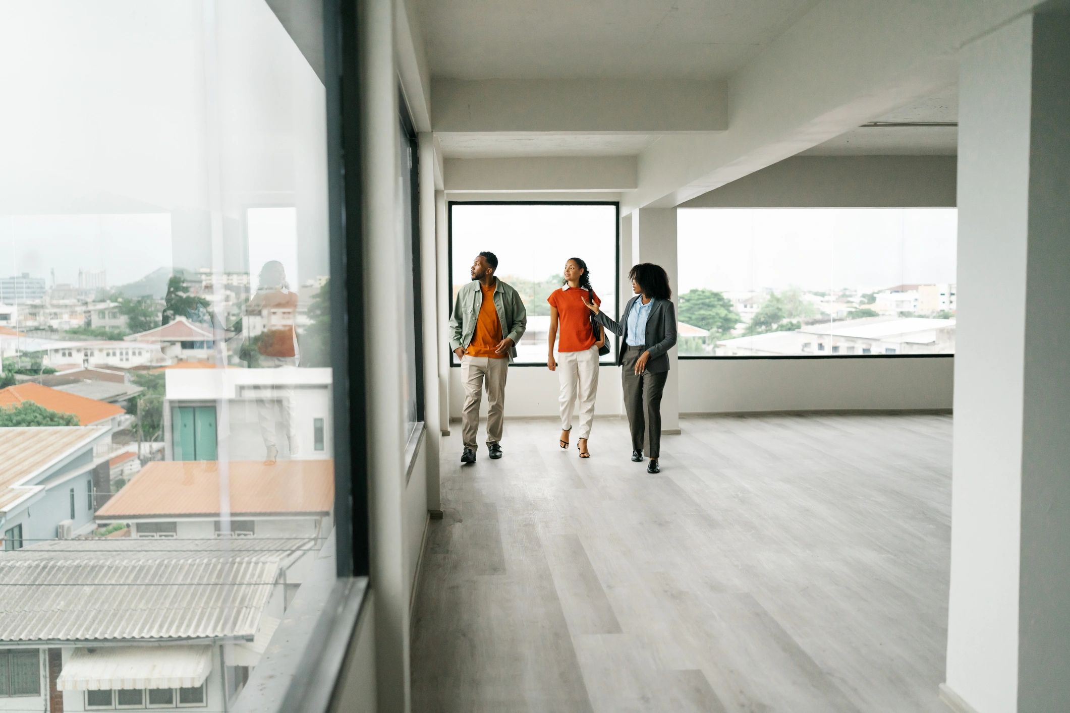 Real estate agent guiding clients through a property
